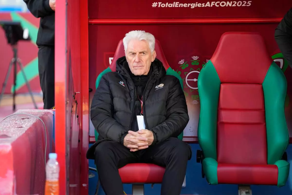 South Africa's head coach Hugo Broos sits on the bench ahead of the Africa Cup of Nations group B soccer match between Angola and South Africa in Marrakech, Morocco, Monday, Dec. 22, 2025. (AP Photo/Themba Hadebe)