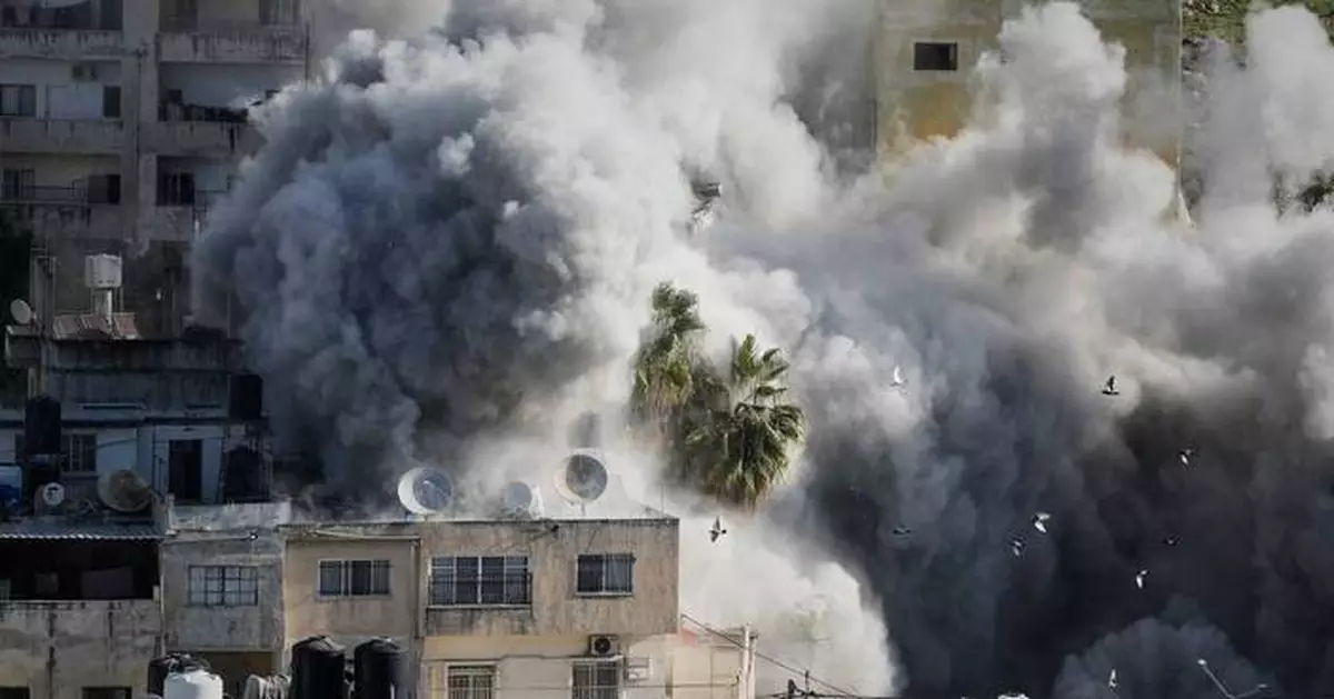 Israeli forensics experts examine remains handed over by militants in Gaza