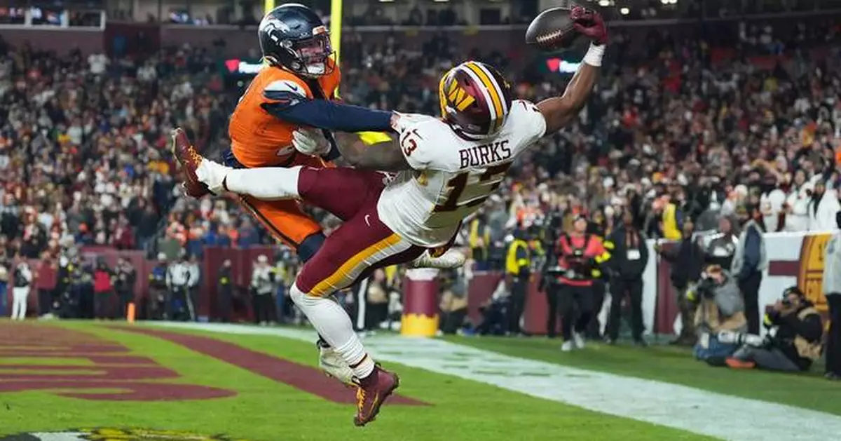 Catch of the year? Commanders' Treylon Burks makes incredible 1-handed TD grab vs. Broncos