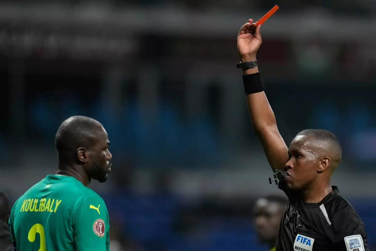 Senegal's Kalidou Koulibaly is shown a red card during the Africa Cup of Nations group D soccer match between Benin and Senegal in Tangier, Morocco, Tuesday, Dec. 30, 2025. (AP Photo/Themba Hadebe)