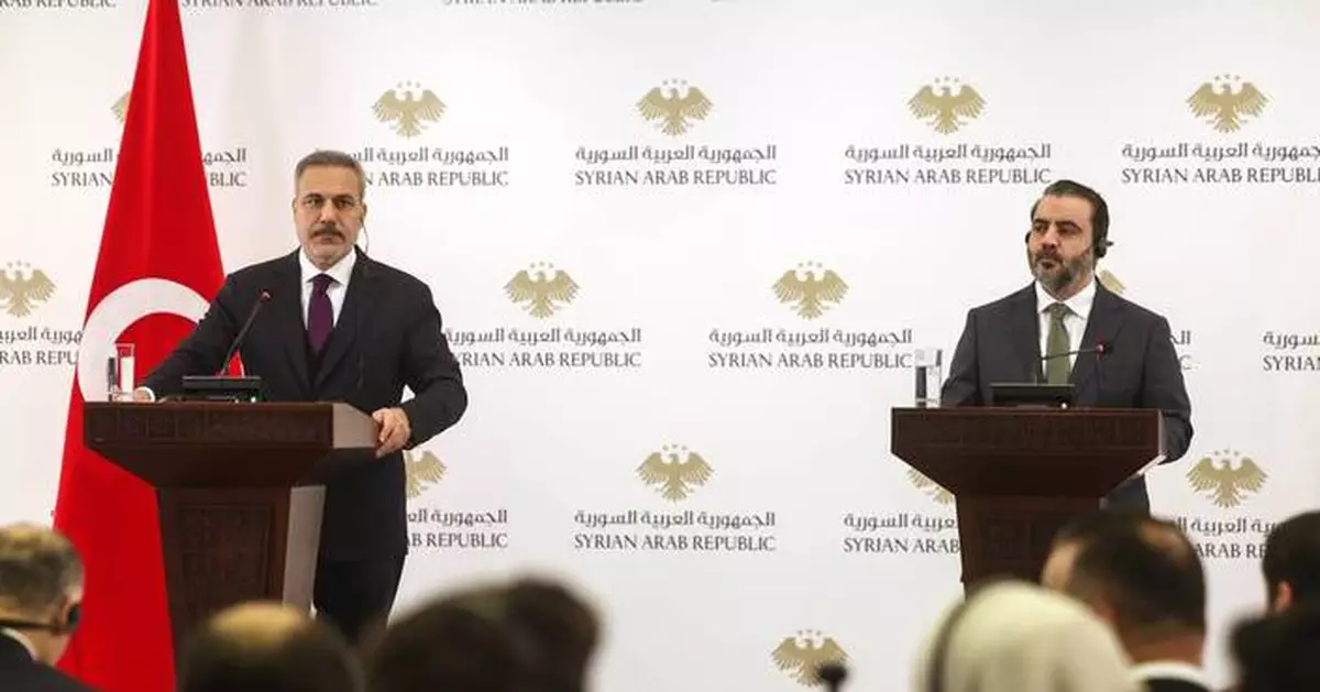 Clashes flare as top Turkish officials visit Syria ahead of a deadline for Kurdish integration