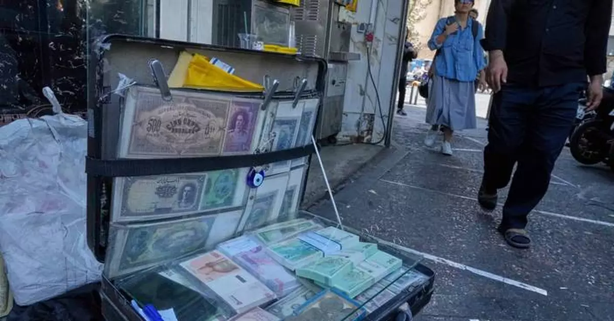 Iran's currency falls to a new low as nuclear sanctions squeeze its ailing economy