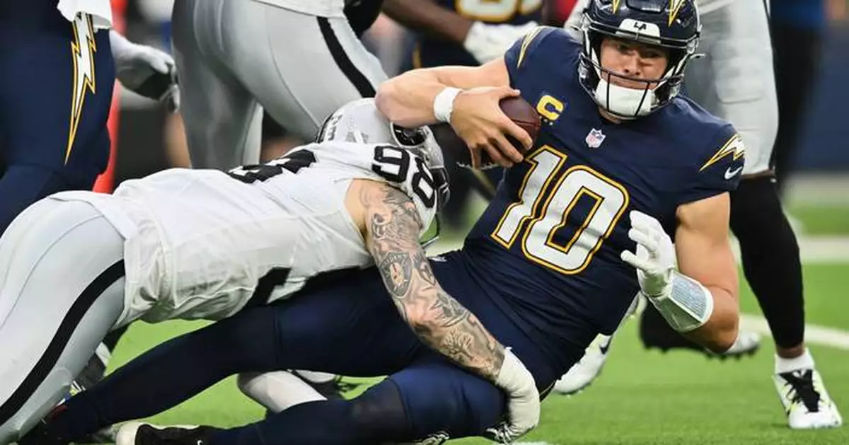 Chargers QB Justin Herbert misses practice Wednesday, 2 days after surgery on non-throwing hand