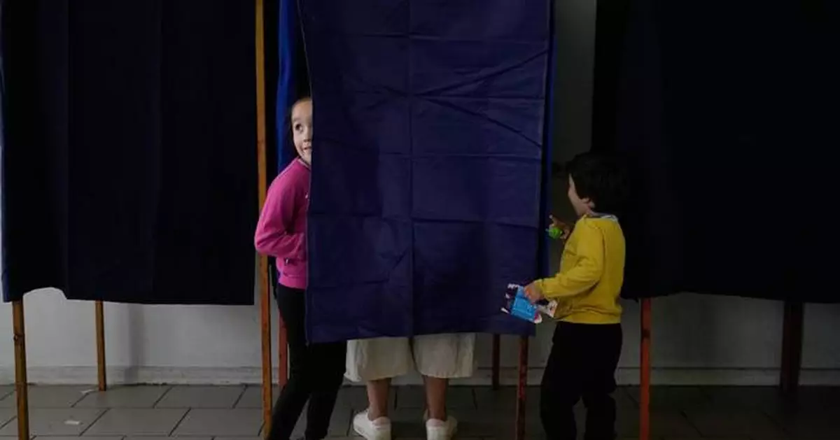 Photos of voters taking part in Chile's runoff presidential election
