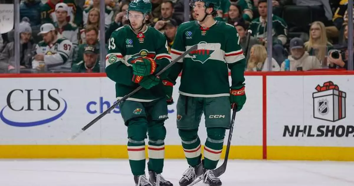 Quinn Hughes scores in Minnesota debut as Wild beat Bruins 6-2 for 4th straight win