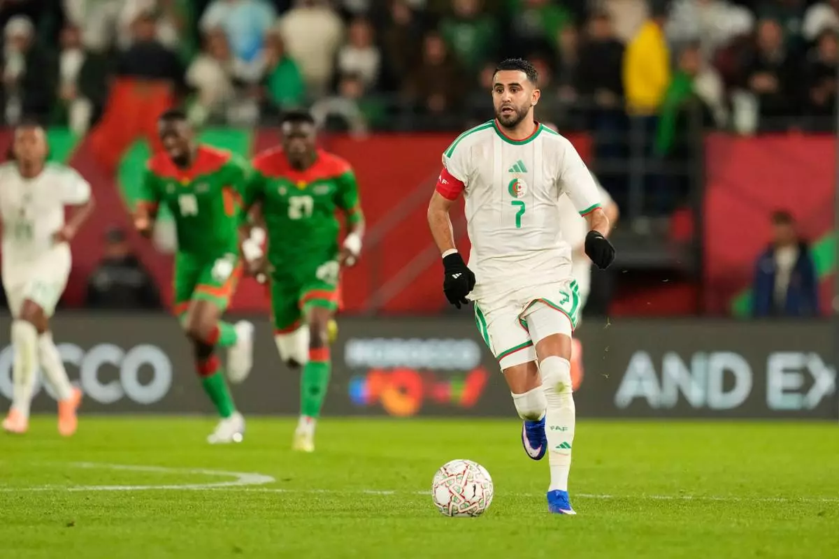 Algeria's Riyad Karim Mahrez controls the ball during the Africa Cup of Nations group E soccer match between Algeria and Burkina Faso in Rabat, Morocco, Sunday, Dec. 28, 2025. (AP Photo/Mosa'ab Elshamy)