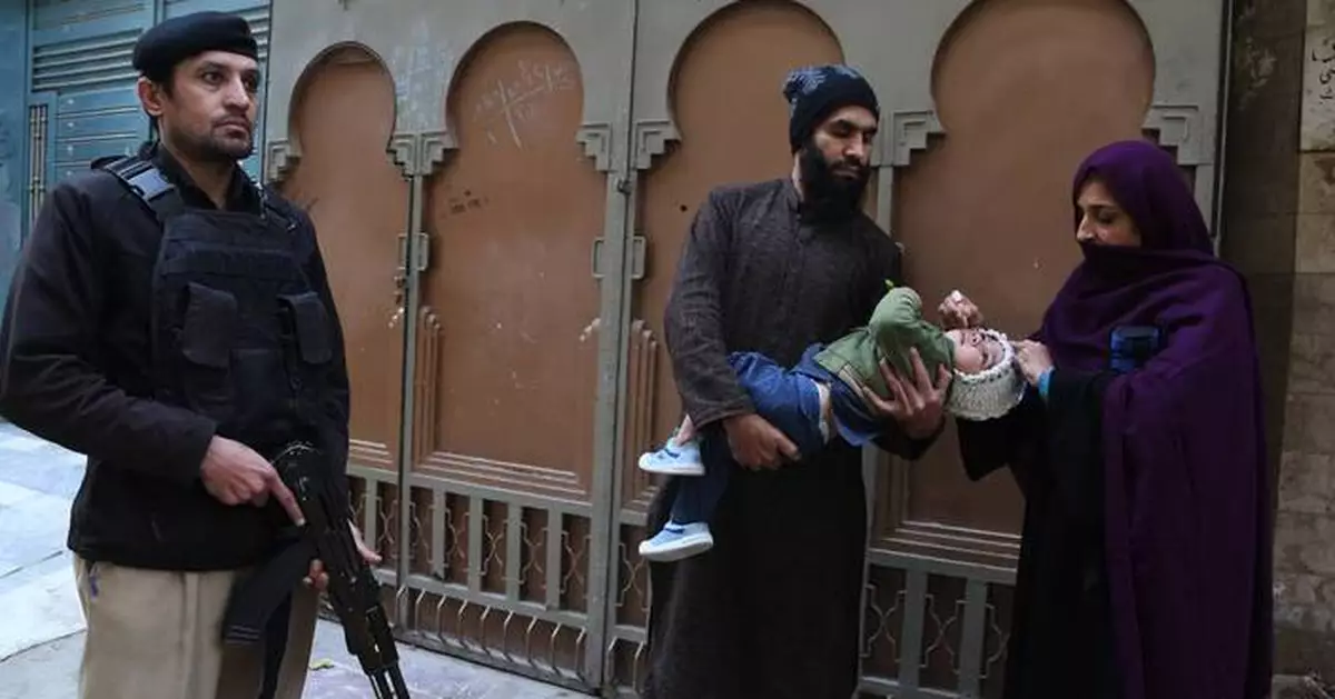 Suspected militants kill 2, including a police officer guarding polio team in northwestern Pakistan