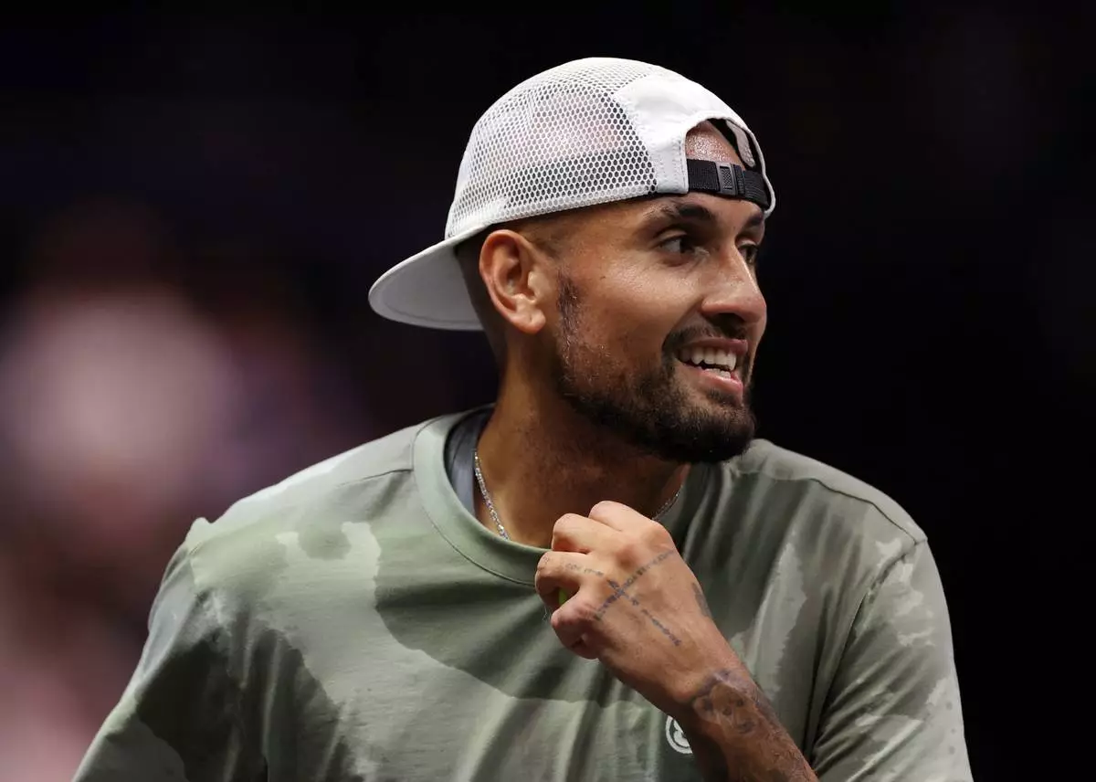 Nick Kyrgios reacts during his Battle of the Sexes tennis match against Aryna Sabalenka, in Dubai, United Arab Emirates, Sunday Dec. 28, 2025. (Amr Alfiky/Pool Photo via AP)