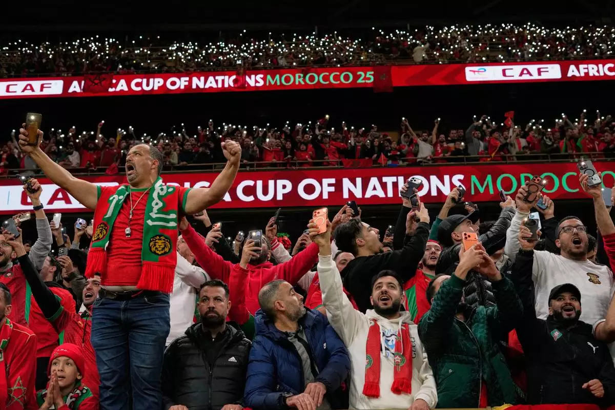 Morocco's fans celebrate during the Africa Cup of Nations group A soccer match between Zambia and Morocco in Rabat, Morocco, Monday, Dec. 29, 2025. (AP Photo/Themba Hadebe)