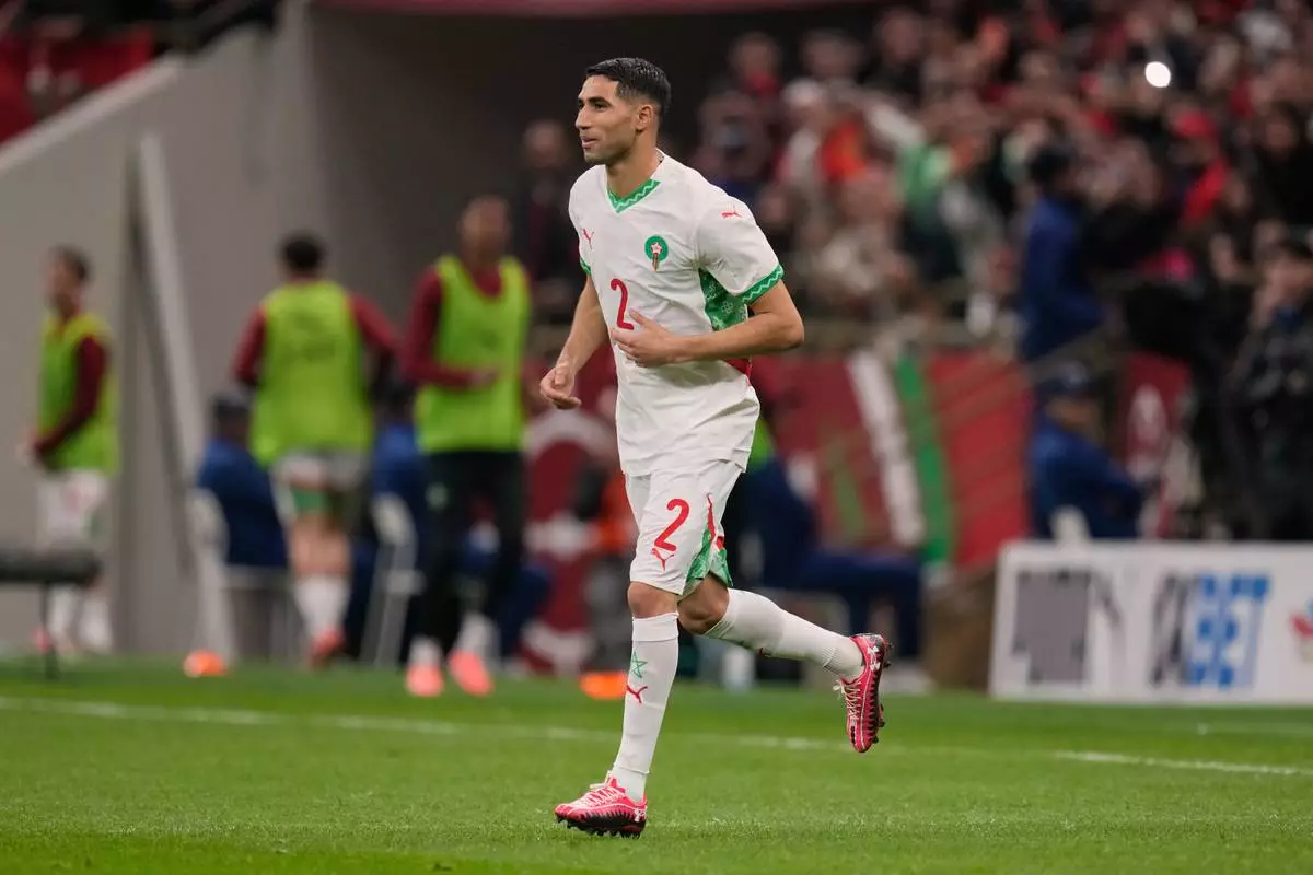 Morocco's Achraf Hakimi comes on during the second half of the Africa Cup of Nations group A soccer match between Zambia and Morocco in Rabat, Morocco, Monday, Dec. 29, 2025. (AP Photo/Themba Hadebe)
