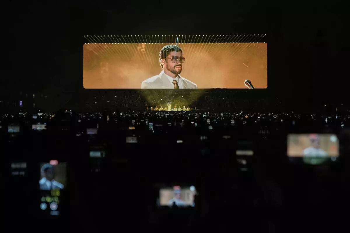 FILE - Puerto Rican rapper Bad Bunny performs during his "DeBÍ TiRAR MáS FOToS" tour in Mexico City, Dec. 10, 2025. (AP Photo/Eduardo Verdugo, File)