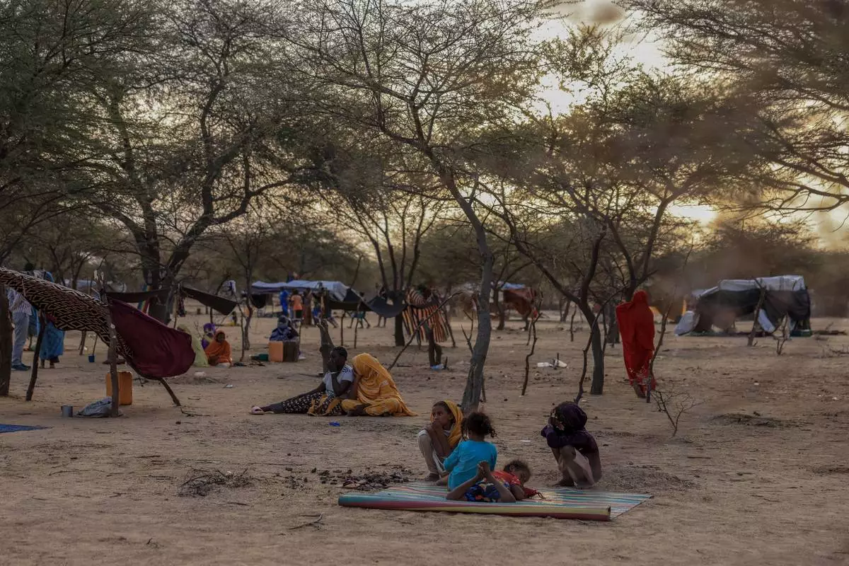 Malian refugees fleeing violence in Mali, sit in a makeshift camp where they found refuge in Douankara, Hodh El Chargui Region, Mauritania, Nov. 9 2025. (AP Photo/Caitlin Kelly)