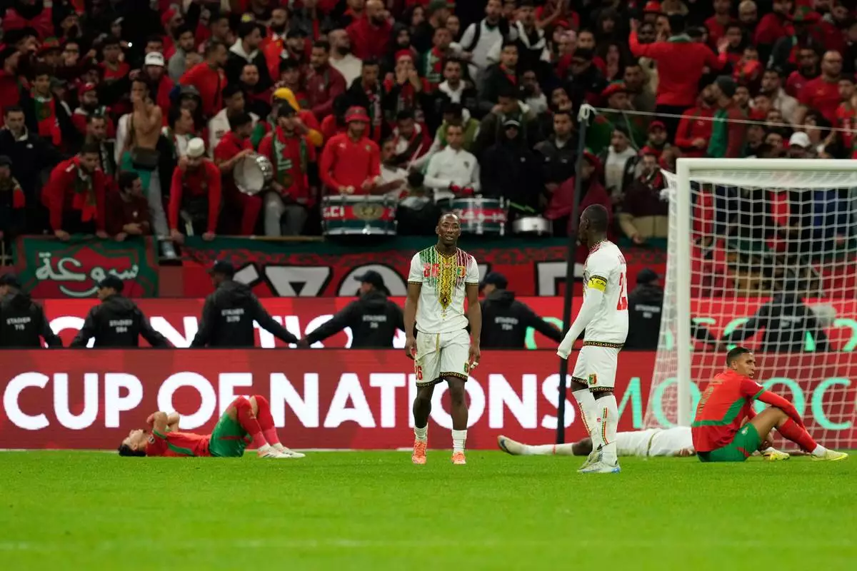 Players react following the African Cup of Nations Group A soccer match between Morocco and Mali in Rabat, Morocco, Friday, Dec. 26, 2025. (AP Photo/Mosa'ab Elshamy)
