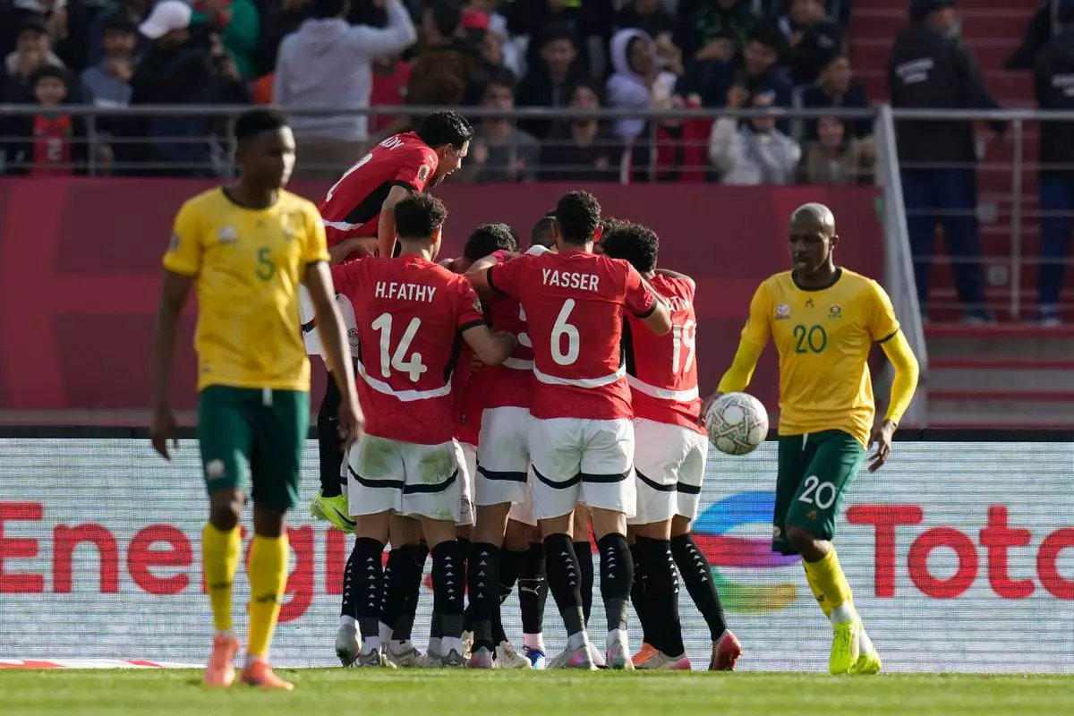 Egypt players celebrate after Egypt's Mohamed Salah scores during the Africa Cup of Nations group B soccer match between Egypt and South Africa in Agadir, Morocco, Friday, Dec. 26, 2025. (AP Photo/Themba Hadebe)