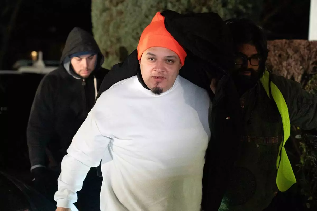 Kilmar Abrego García arrives to his home in Beltsville, Md., Thursday, Dec. 11, 2025, after being released from ICE custody. (AP Photo/Jose Luis Magana)