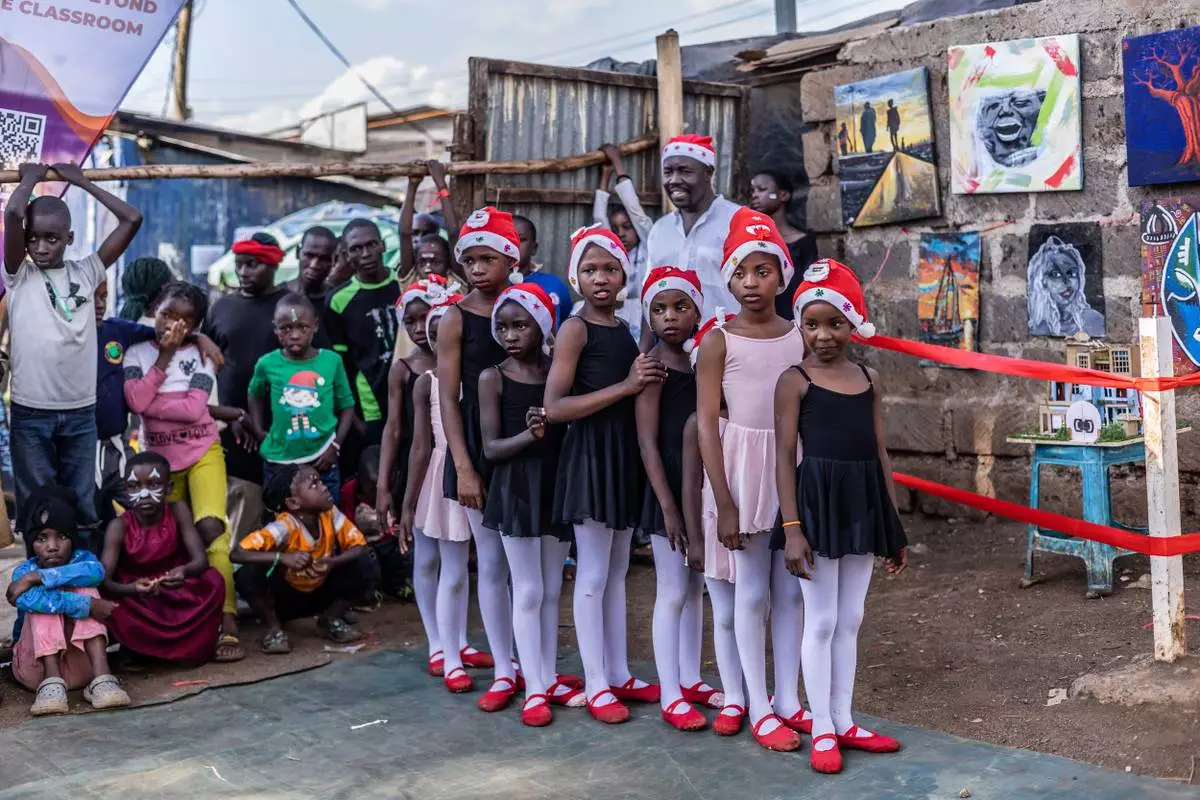 FILE - Young dancers wait to perform during a Christmas ballet event in Nairobi, Tuesday, Dec. 23, 2025. (AP Photo/Samson Otieno, File)
