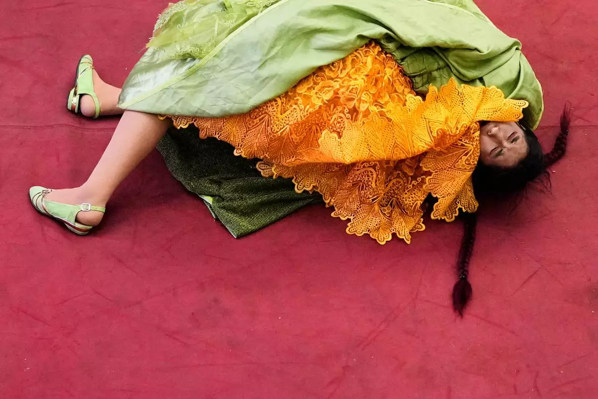 FILE - Fernanda Romero competes during a ticketed wrestling show in El Alto, Bolivia, Saturday, May 3, 2025. (AP Photo/Juan Karita, File)