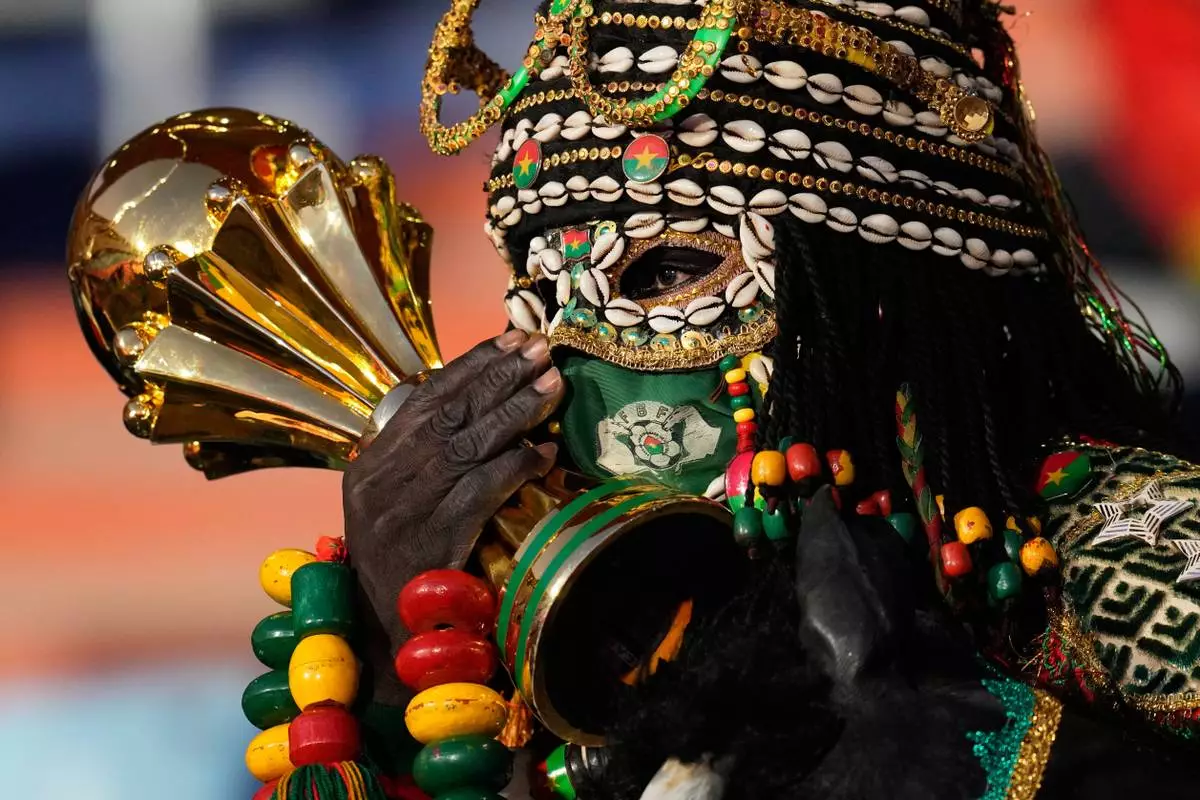 A fan cheers prior the Africa Cup of Nations best of 16 soccer match between Ivory Coast and Burkina Faso in Marrakech, Morocco, Tuesday, Jan. 6, 2026. (AP Photo/Themba Hadebe)