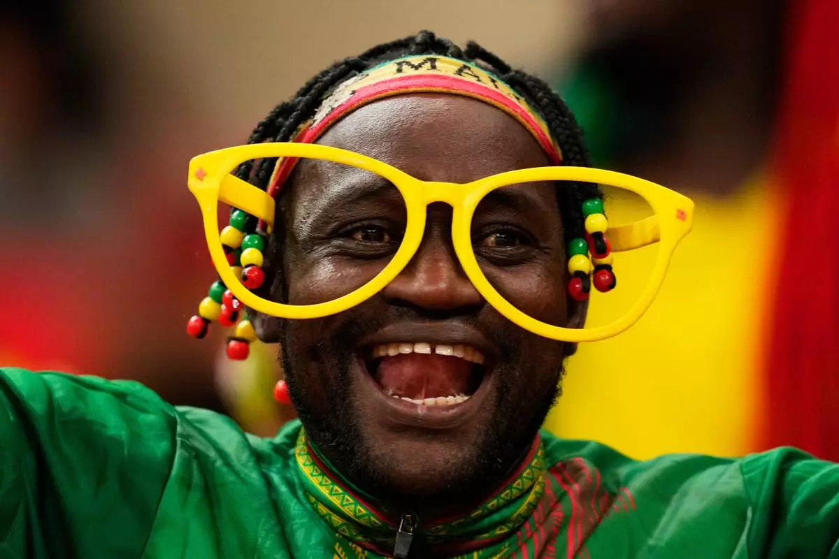 A Mali soccer fan waits for the start of the African Cup of Nations Group A soccer match between Morocco and Mali in Rabat, Friday, Dec. 26, 2025. (AP Photo/Mosa'ab Elshamy)