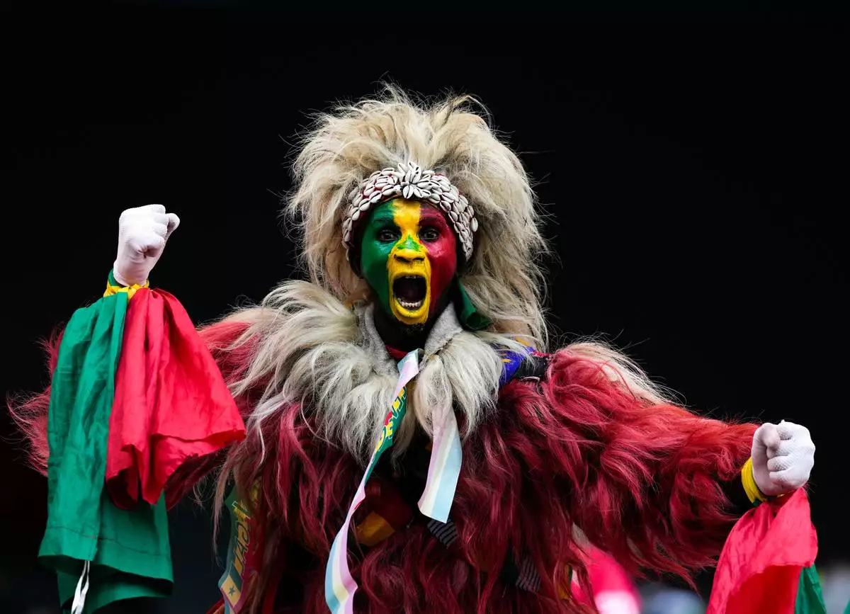 A senegal fan cheers during the Africa Cup of Nations group D soccer match between Senegal and DR Congo in Tangier, Morocco, Saturday, Dec. 27, 2025. (AP Photo/Themba Hadebe)