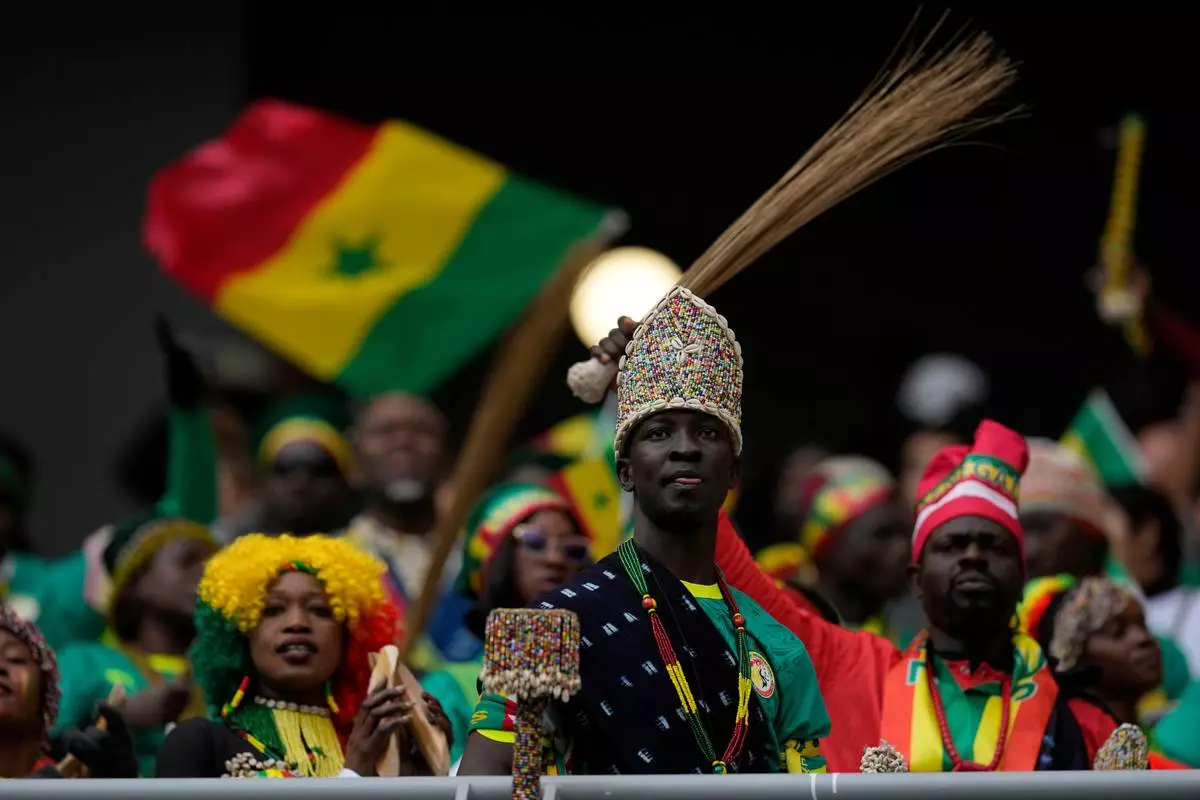 Senegal fans cheer their team during the Africa Cup of Nations group D soccer match between Senegal and DR Congo in Tangier, Morocco, Saturday, Dec. 27, 2025. (AP Photo/Themba Hadebe)