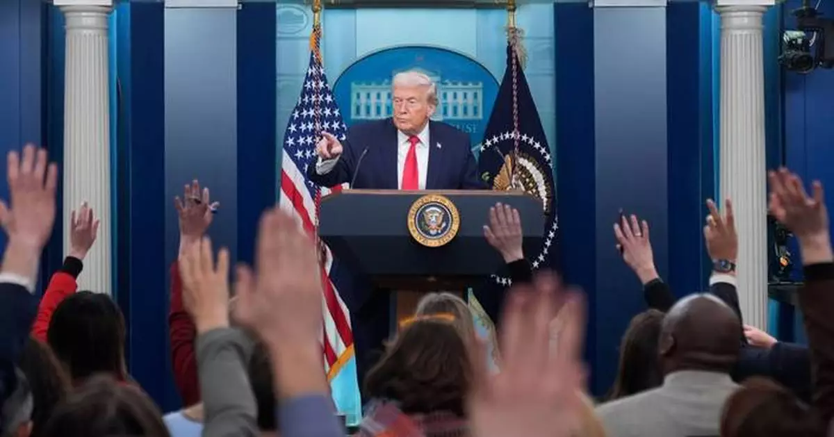 Trump recaps his first year back in office with winding remarks, paper tossing and impressions