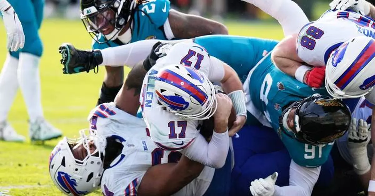 Josh Allen carries Bills to 27-24 win at Jags for Buffalo's first road playoff victory in 33 years