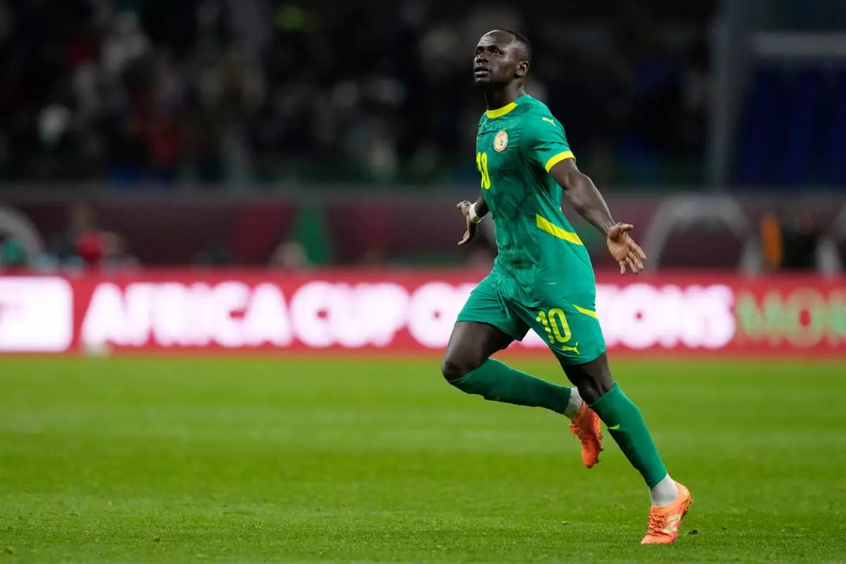 Senegal's Sadio Mane celebrates after scoring his side's opening goal during the Africa Cup of Nations semifinal soccer match between Senegal and Egypt, in Tangier, Morocco, Wednesday, Jan. 14, 2026. (AP Photo/Themba Hadebe)