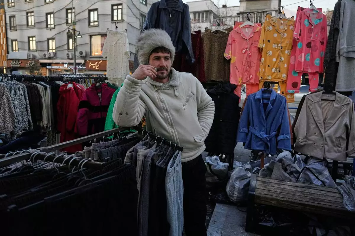 FILE - A vendor waits for customers at Tajrish Square in Tehran, Iran, Tuesday, Jan. 27, 2026. (AP Photo/Vahid Salemi, File)