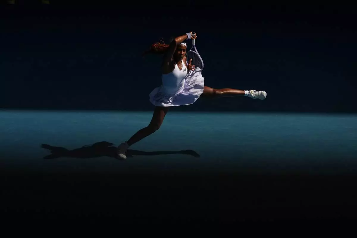 FILE - Coco Gauff of the U.S. plays a forehand return to Karolina Muchova of the Czech Republic during their fourth round match at the Australian Open tennis championship in Melbourne, Australia, Sunday, Jan. 25, 2026. (AP Photo/Asanka Brendon Ratnayake, File)