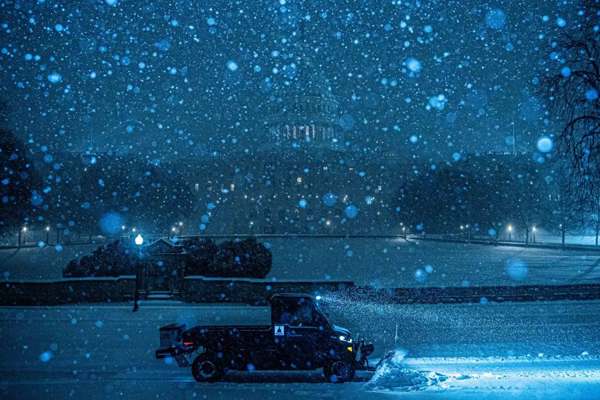 FILE - A plow clears snow in front of the U.S. Capitol, Sunday, Jan. 25, 2026, in Washington. (AP Photo/Julia Demaree Nikhinson, File)