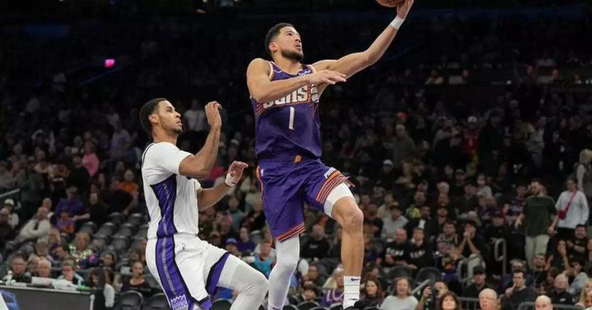 Booker scores 20 in 1st quarter, finishes with 33 as Suns rout Kings 129-102