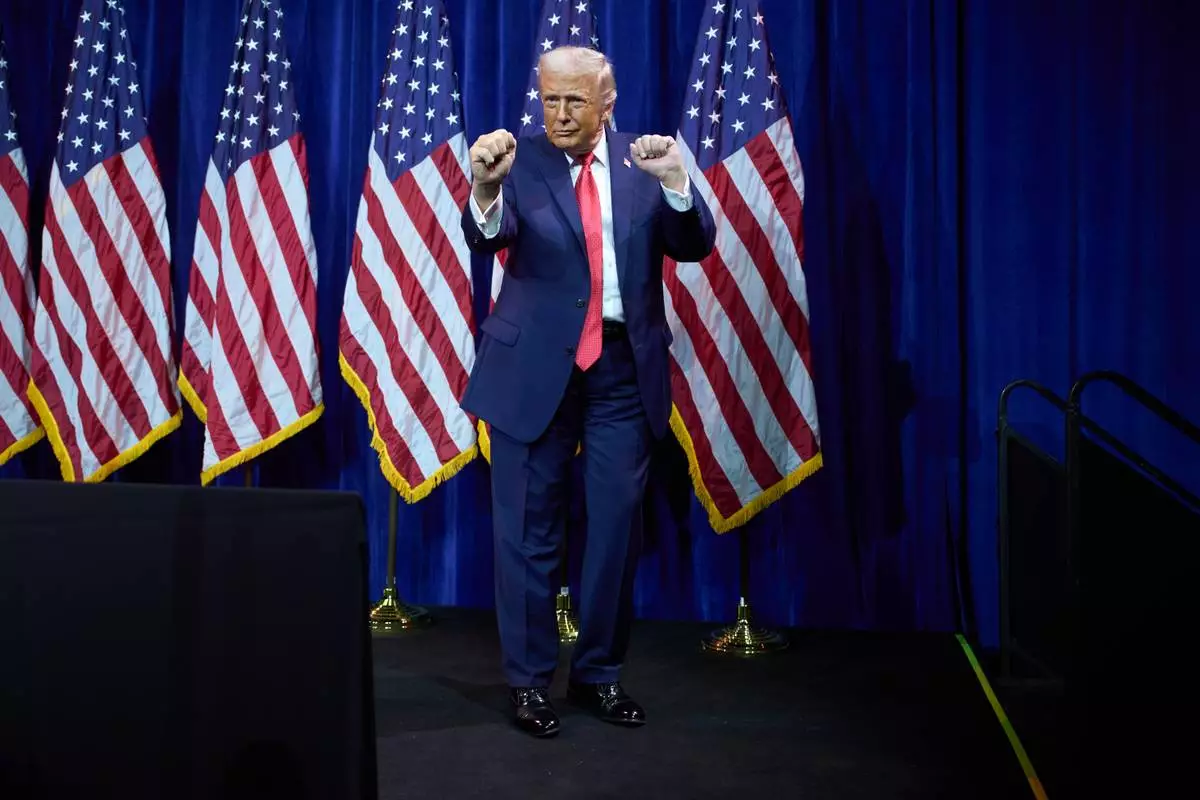 FILE - President Donald Trump dances as he walks off stage after speaking to House Republican lawmakers during their annual policy retreat, Tuesday, Jan. 6, 2026, in Washington. (AP Photo/Evan Vucci, File)