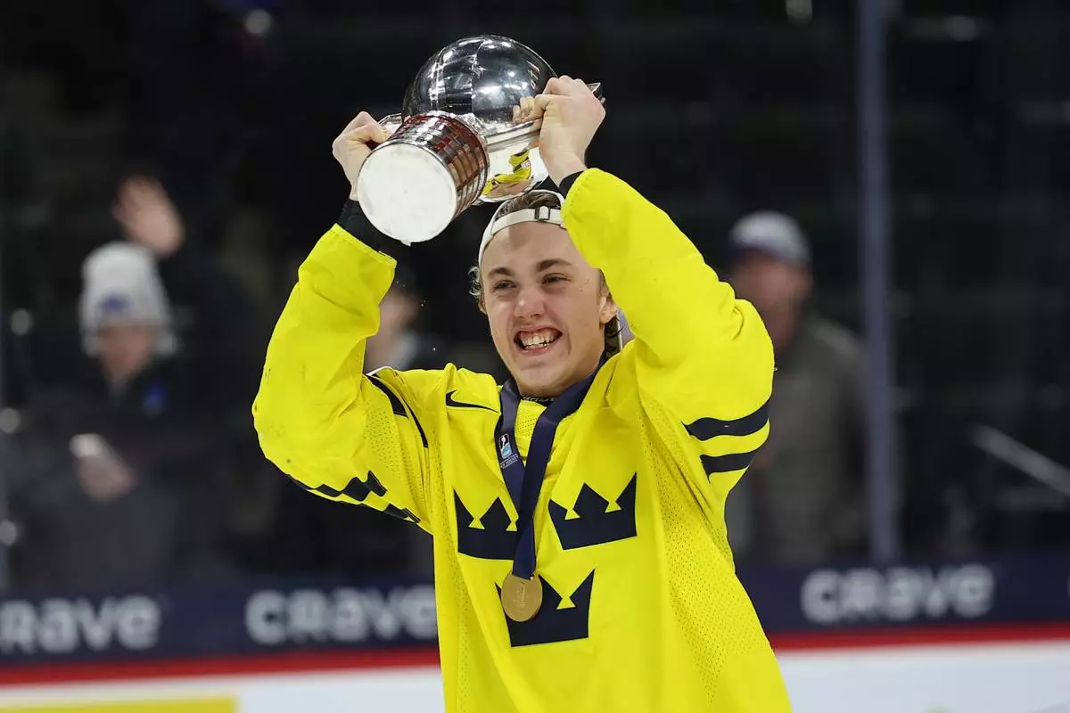 Sweden's Linus Eriksson celebrates after winning an IIHF World Junior Hockey Championship gold medal game against Czechia, Monday, Jan. 5, 2026, in St. Paul, Minn. (AP Photo/Matt Krohn)