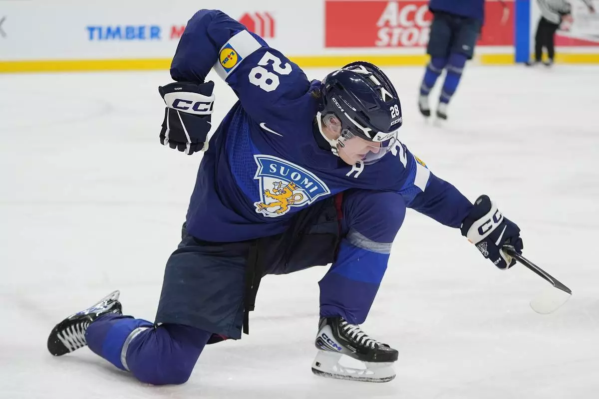 Finland forward Heikki Ruohonen celebrates after scoring a goal during the second period of an IIHF World Junior Hockey Championship quarterfinals game against the United States, Friday, Jan. 2, 2026, in St. Paul, Minn. (AP Photo/Abbie Parr)