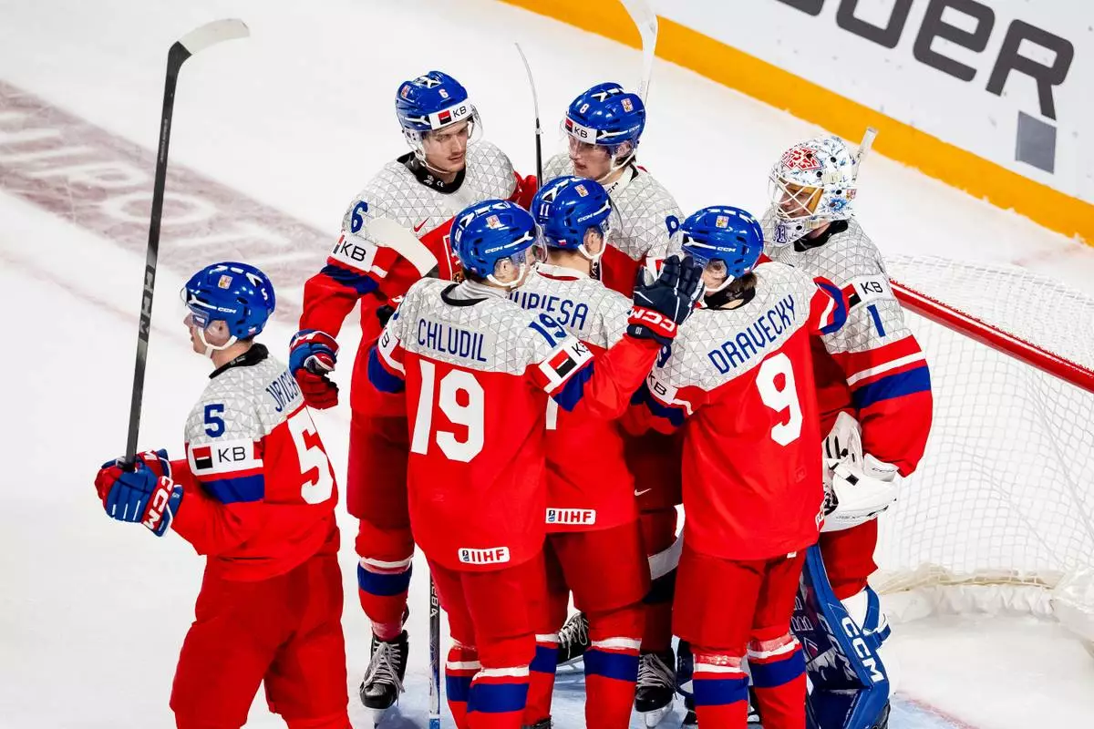 Team Czechia celebrates after defeating Latvia in IIHF World Junior Championship hockey action in Minneapolis on Wednesday, Dec. 31, 2025. (Christopher Katsarov/The Canadian Press via AP)