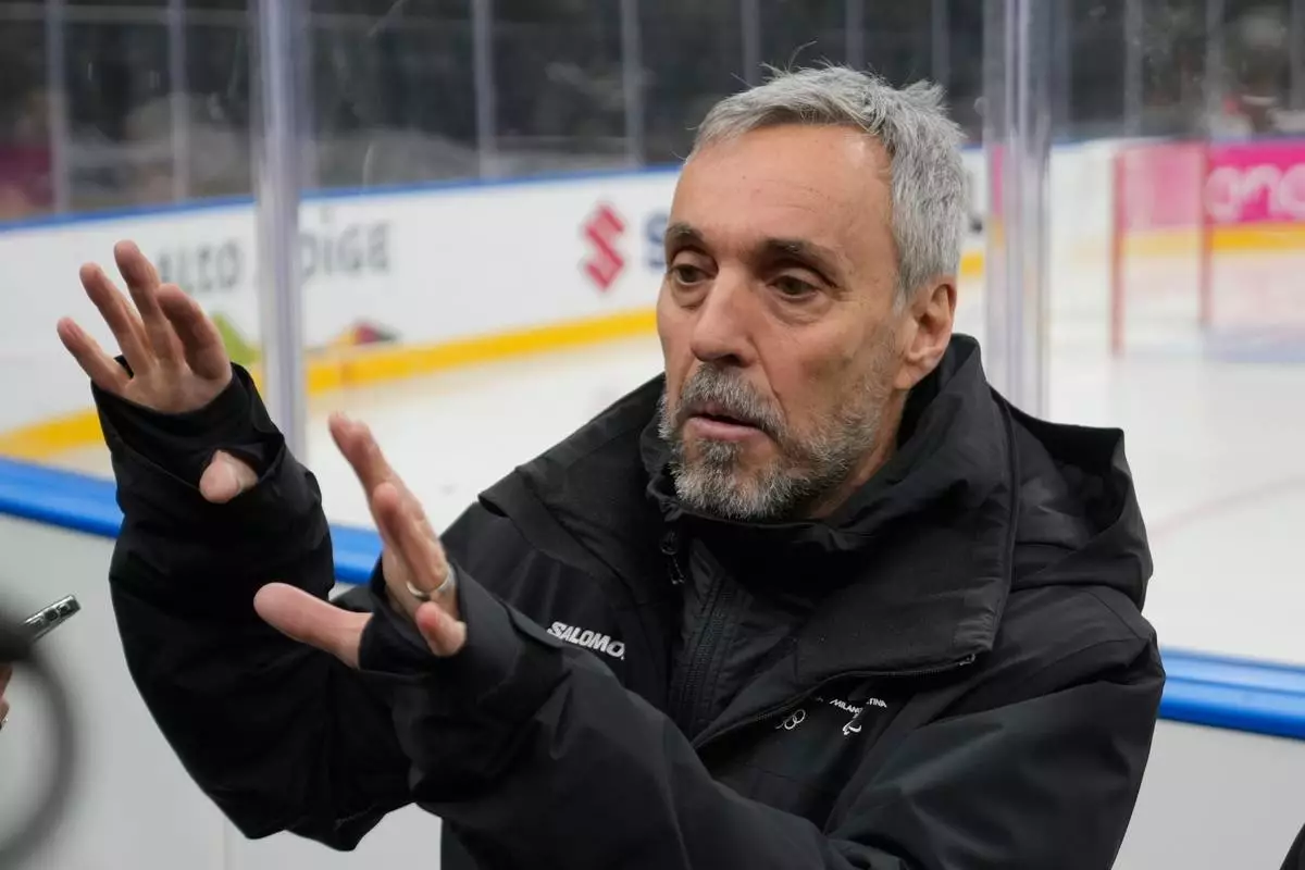Andrea Varnier, CEO Fondazione Milano Cortina 2026 talks to reporters at the Santa Giulia Ice Hockey Arena, in Milan, where Ice Hockey discipline of the Milan Cortina 2026 Winter Olympics will take place, in Milan, Italy, Sunday, Jan. 11, 2026. (AP Photo/Luca Bruno)