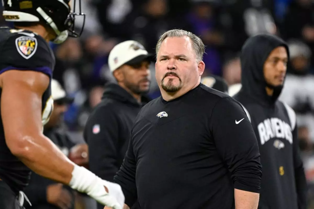 FILE - Baltimore Ravens offensive coordinator Greg Roman looks on during pre-game warm-ups before an NFL football game against the Pittsburgh Steelers, Jan. 1, 2023, in Baltimore. (AP Photo/Terrance Williams, File)