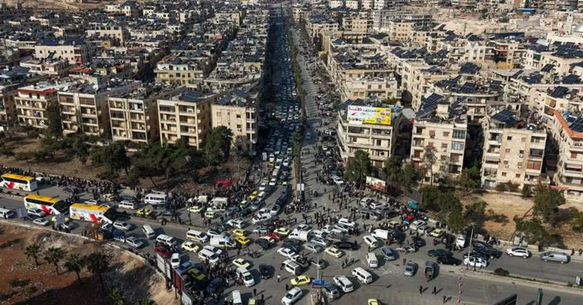 Tens of thousands flee Aleppo neighborhoods as Syrian government clashes with Kurds intensify