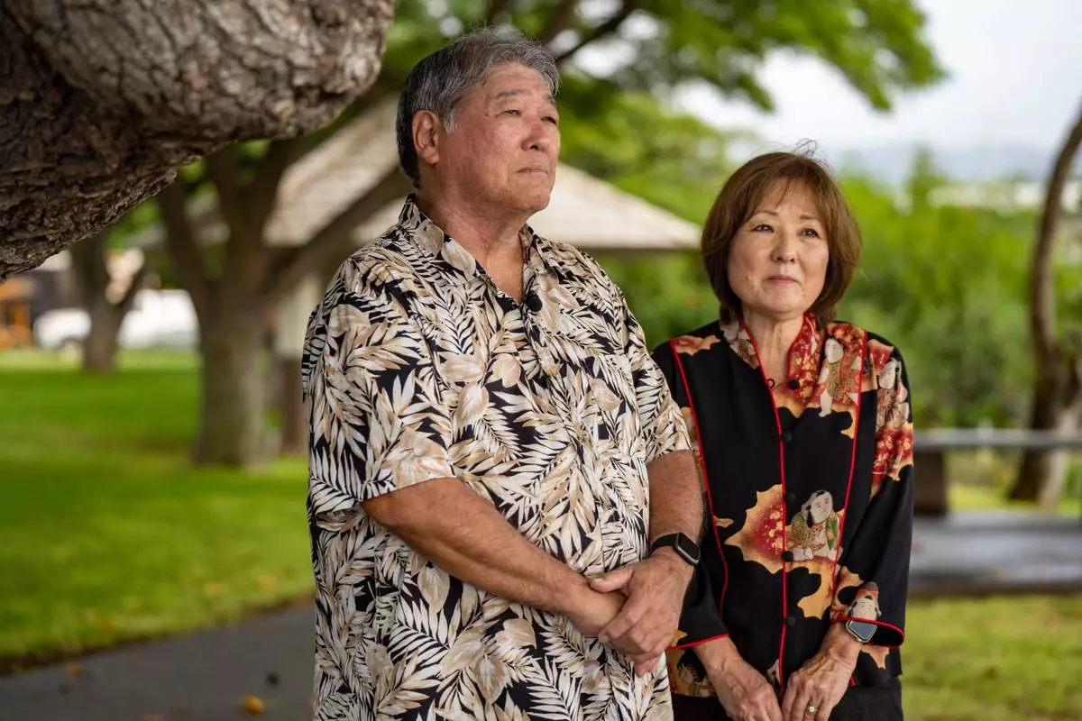 Clifford Urabe, left, and June Harada, nephew and niece of Howard Urabe, a former University of Hawaii ROTC cadet, are interviewed after a posthumous commissioning ceremony at Ke'ehi Lagoon Memorial Park, Monday, Jan. 26, 2026, in Honolulu. (AP Photo/Mengshin Lin)