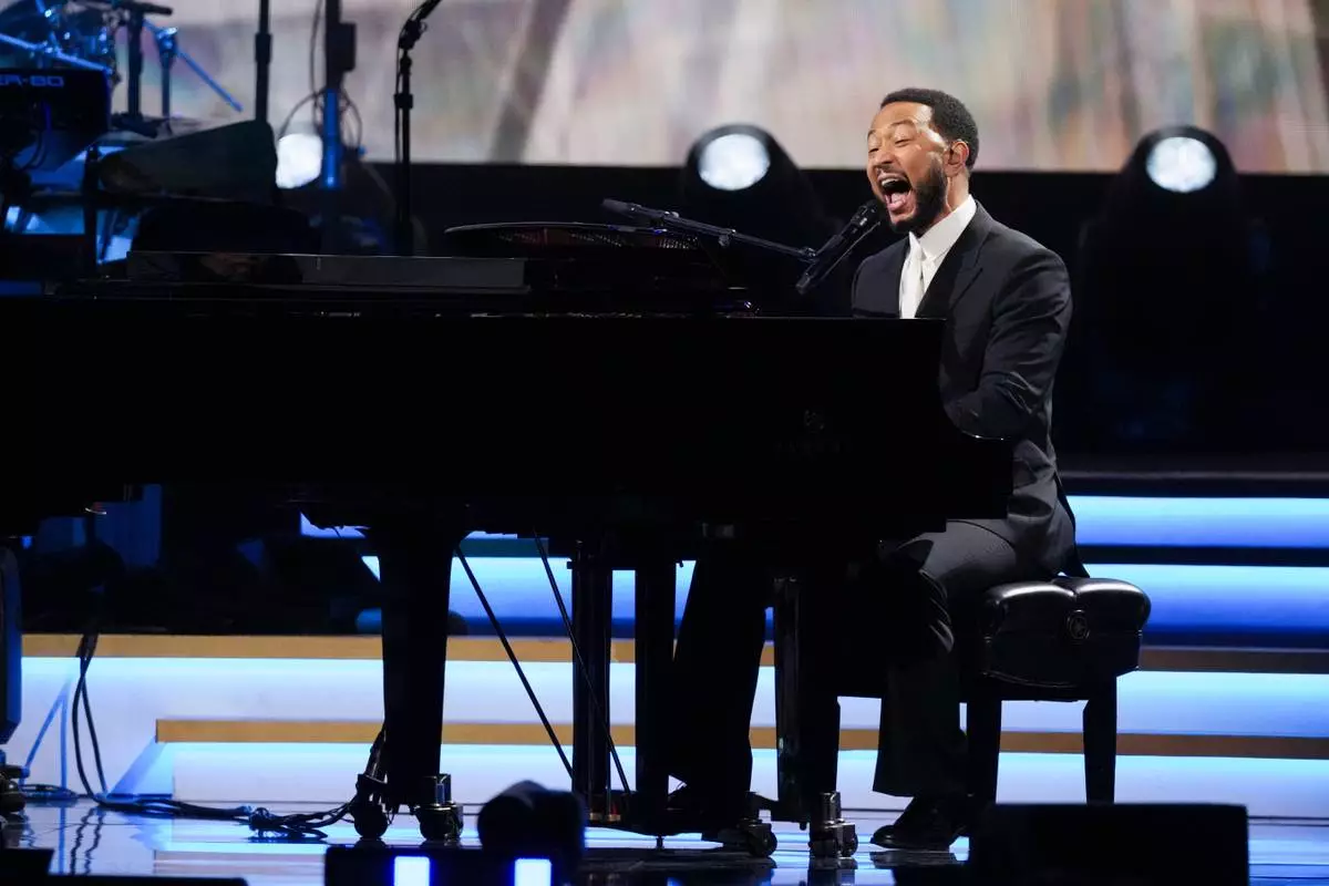 John Legend performs 'Hero' during MusiCares Person of the Year honoring Mariah Carey on Friday, Jan. 30, 2026, in Los Angeles. (AP Photo/Chris Pizzello)