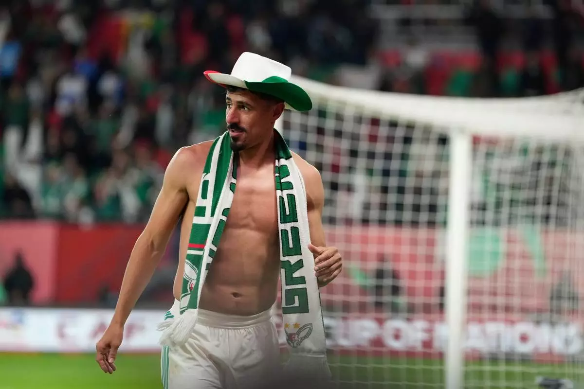 Algeria's Baghdad Bounedjah celebrates after the Africa Cup of Nations round of 16 soccer match between Algeria and DR Congo in Rabat, Morocco, Tuesday, Jan. 6, 2026. (AP Photo/Mosa'ab Elshamy)