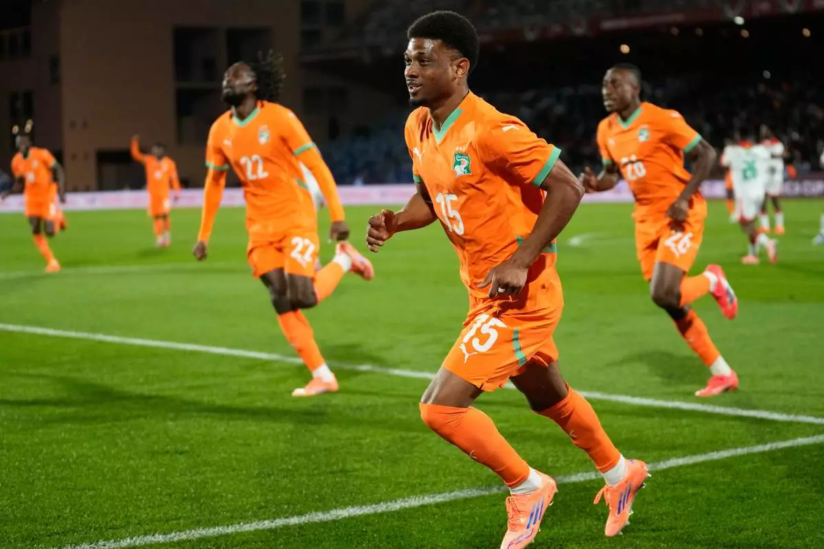Ivory Coast's Amad Diallo celebrates after scoring his sides first goal during the Africa Cup of Nations best of 16 soccer match between Ivory Coast and Burkina Faso in Marrakech, Morocco, Tuesday, Jan. 6, 2026. (AP Photo/Themba Hadebe)