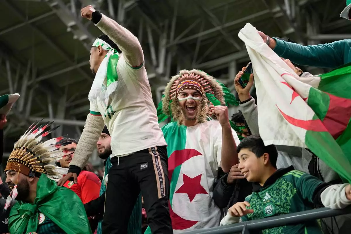 Algeria fans celebrate after the Africa Cup of Nations round of 16 soccer match between Algeria and DR Congo in Rabat, Morocco, Tuesday, Jan. 6, 2026. (AP Photo/Mosa'ab Elshamy)