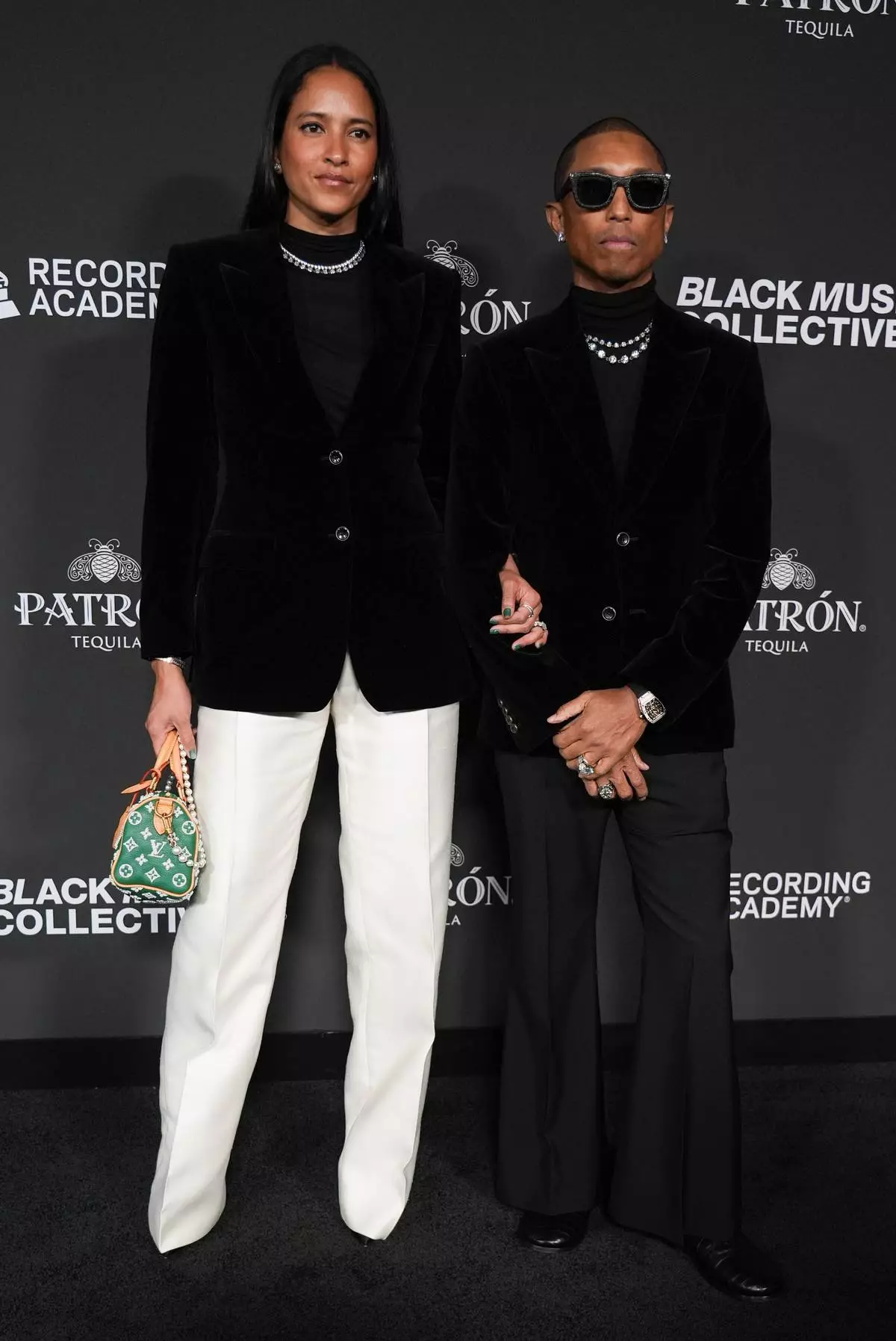 Helen Lasichanh, left, and Pharrell Williams attend the Recording Academy Honors presented by the Black Music Collective on Thursday, Jan. 29, 2026, in Los Angeles. (Photo by Richard Shotwell/Invision/AP)
