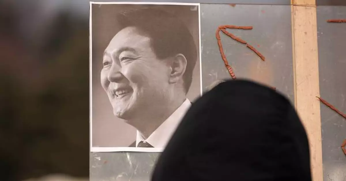 A South Korean court sentences Yoon to 5 years in prison on charges related to martial law decree