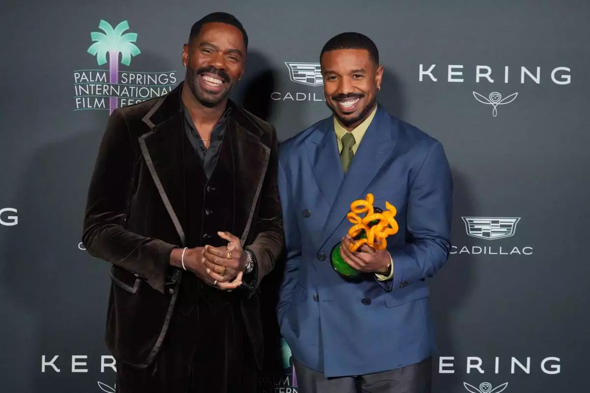 Colman Domingo, left, and Michael B. Jordan, with the icon award for his performance in "Sinners," pose in the press room during the 37th Palm Springs International Film Festival Film Awards on Saturday, Jan. 3, 2026 at Palm Springs Convention Center in Palm Springs, Calif. (Photo by Jordan Strauss/Invision/AP)