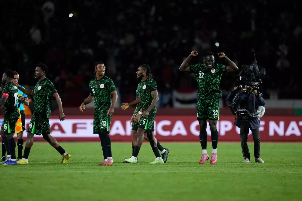Nigeria national team react after winning on penalties during the Africa Cup of Nations third place game between Egypt and Nigeria in Casablanca, Morocco, Saturday, Jan. 17, 2026. (AP Photo/Themba Hadebe)