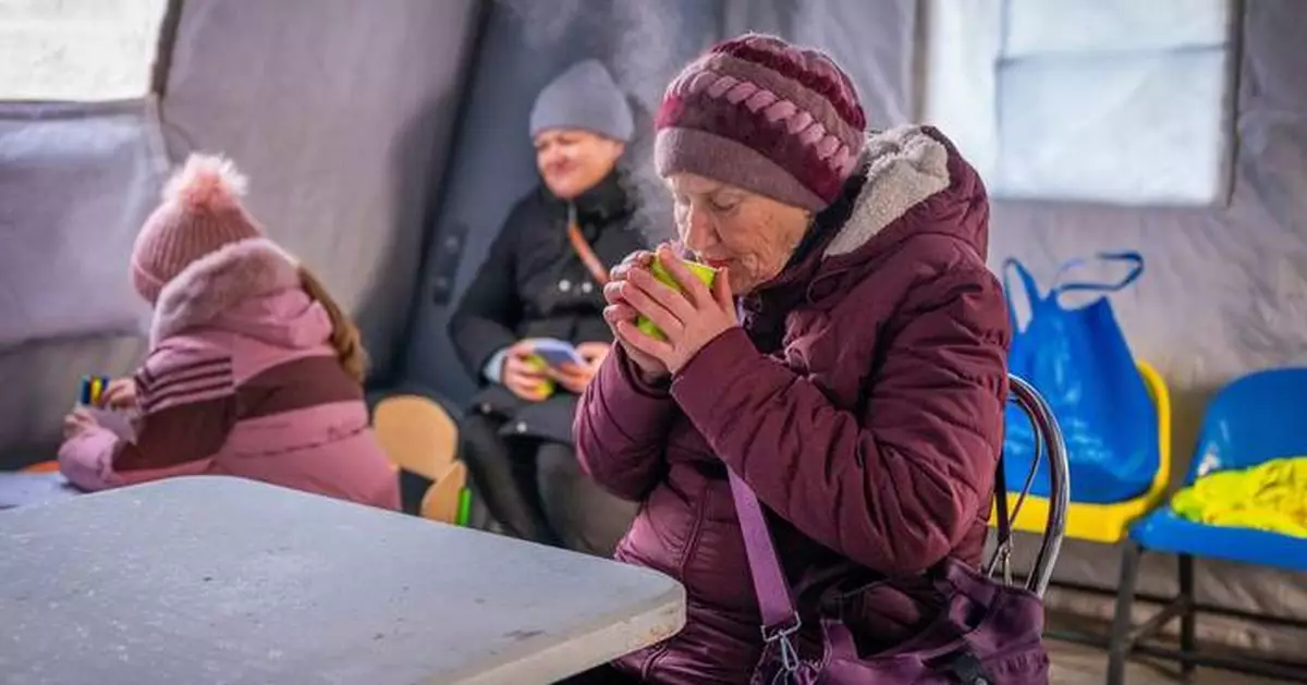 Photos show Ukrainians enduring a frigid winter after Russian strikes knocked out power