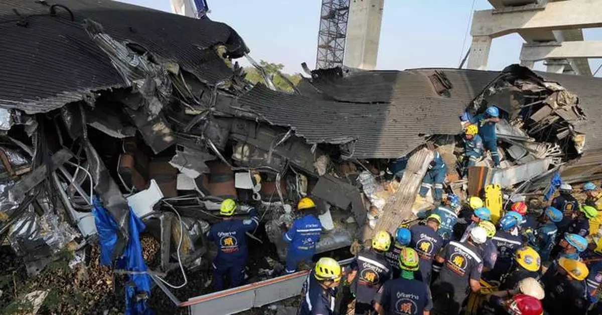 Photos show rescue workers at scene of crane collapse and train derailment in Thailand